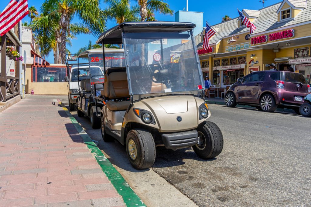Golf carts parked on street